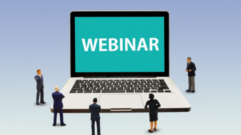 PCにWEBINAR表示　集う会社員