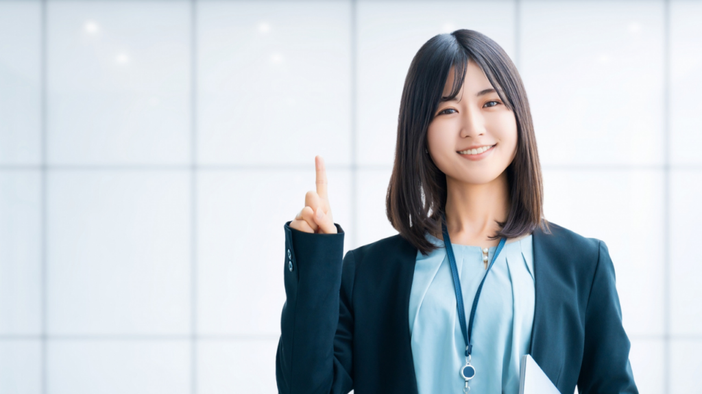 人差し指を立てる女性